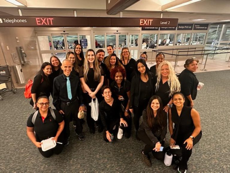 Orlando conference staff welcome attendees at airport