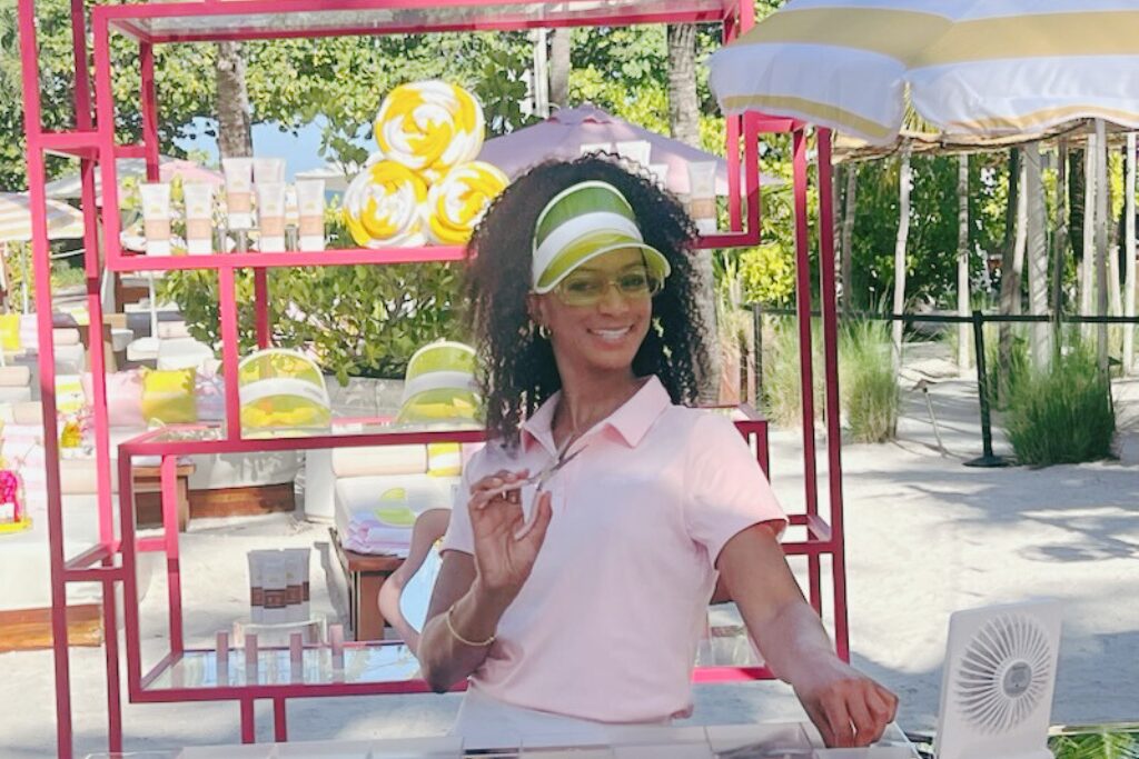 Brand ambassadors engaging attendees at experiential marketing event for Cover Girl